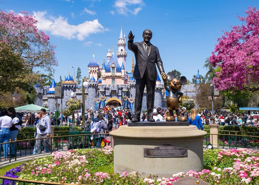 Disneyland Anaheim castle and Walt Disney and Mickey Mouse statue